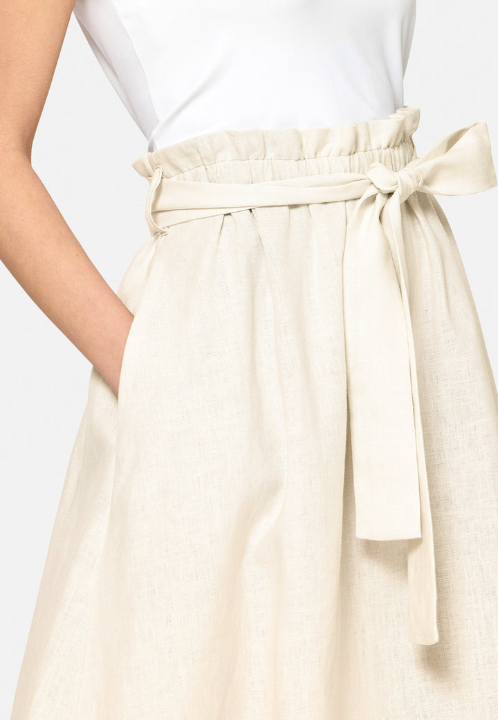 Meg, an easy-fitting, pull-on linen skirt that embraces a laid-back spirit. A piece you can't travel without. Designed to sit on the high waist for a flattering fit. Features a detachable belt. Paper bag elasticated waist for all day comfort. Cut from a breathable Irish linen. Pair it with a simple tee and the co-ordinating Cassie boyfriend-blazer with trainers for a chic and contemporary look.