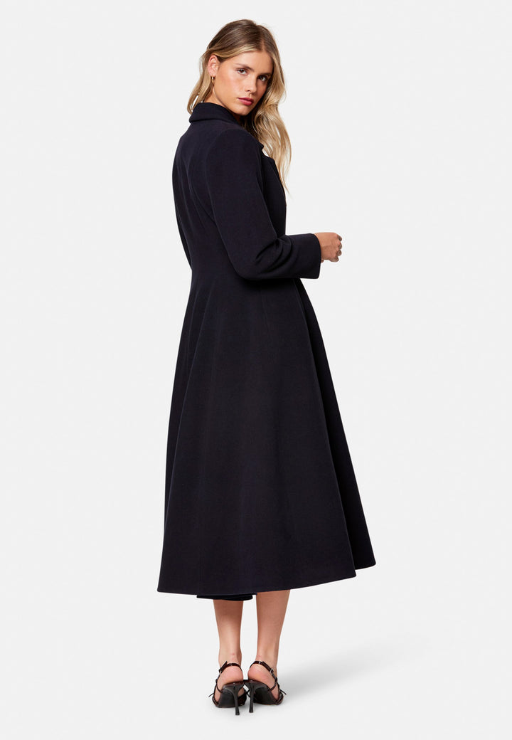 Embrace 50s glamour with Scarlett, a captivating coat crafted from a wool and cashmere melton blend. Designed with a double-breasted, fit-and-flare silhouette, it features a cinched waist, oversized shawl collar and practical side seam pockets. Perfect for winter weddings or any occasion where you desire a touch of glamour and warmth – combining style and functionality in one stunning piece.