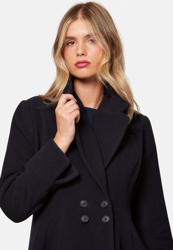 Embrace 50s glamour with Scarlett, a captivating coat crafted from a wool and cashmere melton blend. Designed with a double-breasted, fit-and-flare silhouette, it features a cinched waist, oversized shawl collar and practical side seam pockets. Perfect for winter weddings or any occasion where you desire a touch of glamour and warmth – combining style and functionality in one stunning piece.
