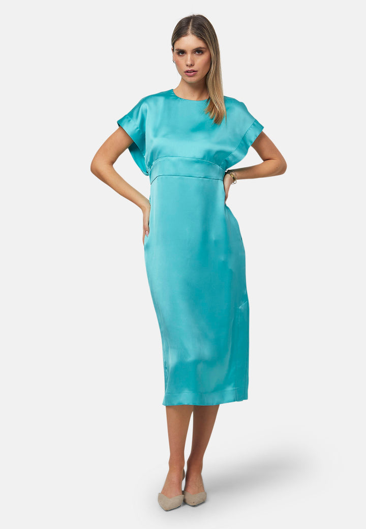 Elevate your wardrobe with the Shiv dress, a simple aqua midi dress in satin. Featuring dropped sleeves, a gathered back waist seam, and a side slit for ease of movement. The back has a keyhole detail with a button closure. Perfect for a summer wedding or afternoon luncheons.