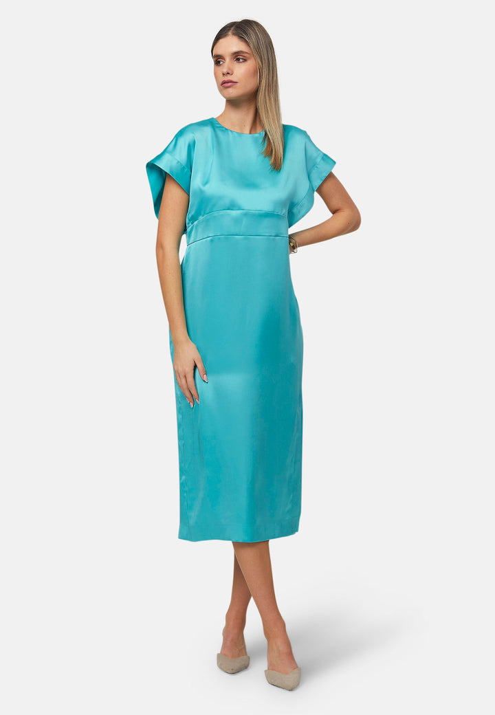 Elevate your wardrobe with the Shiv dress, a simple aqua midi dress in satin. Featuring dropped sleeves, a gathered back waist seam, and a side slit for ease of movement. The back has a keyhole detail with a button closure. Perfect for a summer wedding or afternoon luncheons.
