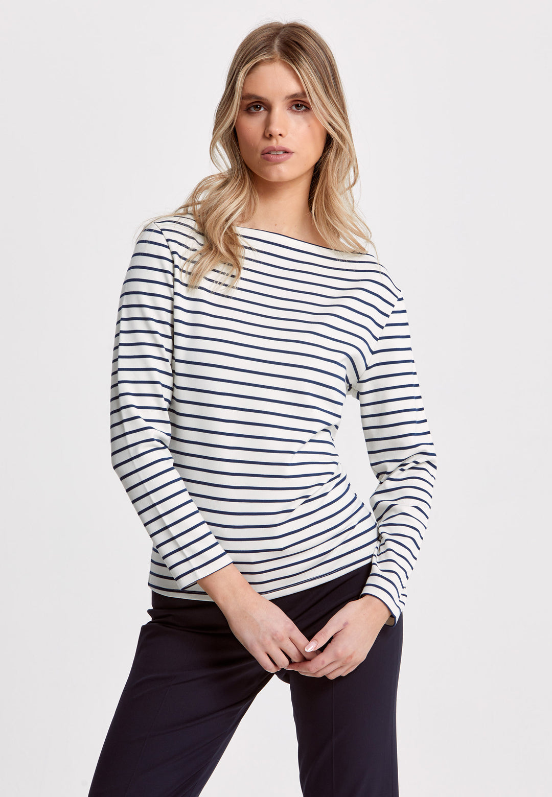 Experience the timeless elegance of our Teagan Stripe Top, expertly crafted with a luxurious stretch jersey and complemented by a sleek round neck. Available in both ecru and navy stripe, it's a must-have essential for any sophisticated wardrobe.