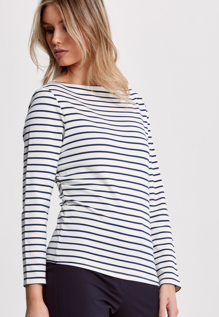 Experience the timeless elegance of our Teagan Stripe Top, expertly crafted with a luxurious stretch jersey and complemented by a sleek round neck. Available in both ecru and navy stripe, it's a must-have essential for any sophisticated wardrobe.