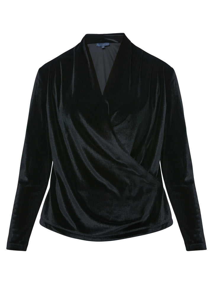 Introducing the Roxanne Black Velvet Top, an updated version of the beloved best-selling faux-wrap topc This exquisite top features a sleek silhouette with a beautifully draped V-neckline, adding a touch of elegance to any ensemble. Crafted from luxurious black stretch velvet, it exudes sophistication and opulence. With its hip-length cut and full-length sleeves, this top effortlessly combines comfort and style. Elevate your wardrobe with the Roxanne Black Velvet Top, the epitome of refined chic.