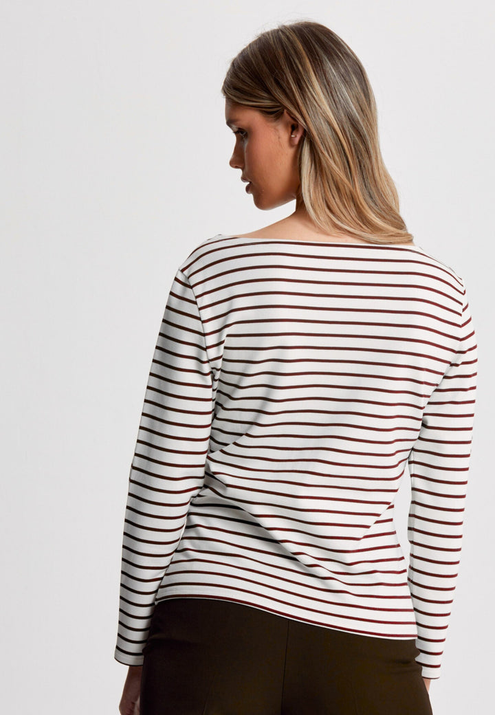 The Teagan boat neck top, crafted in a luxe stretch jersey. Features bracelet length sleeve. Now available in a sandlewood and ecru stripe.