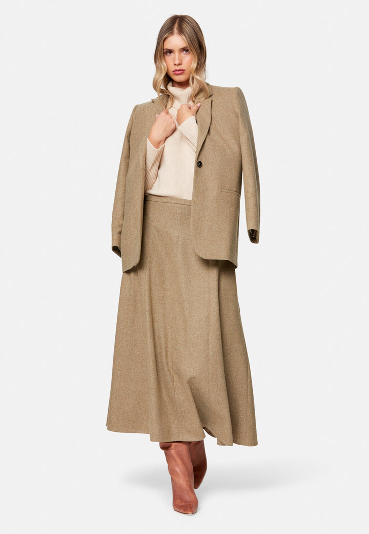 women wearing wool beige long skirt
