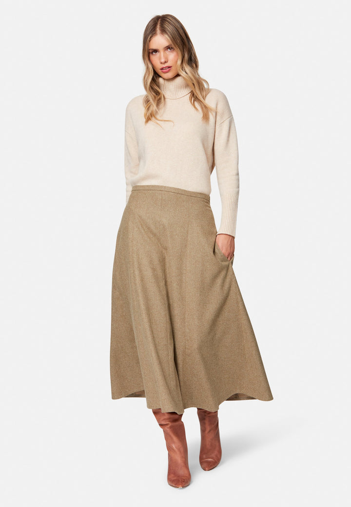 women wearing wool beige long skirt