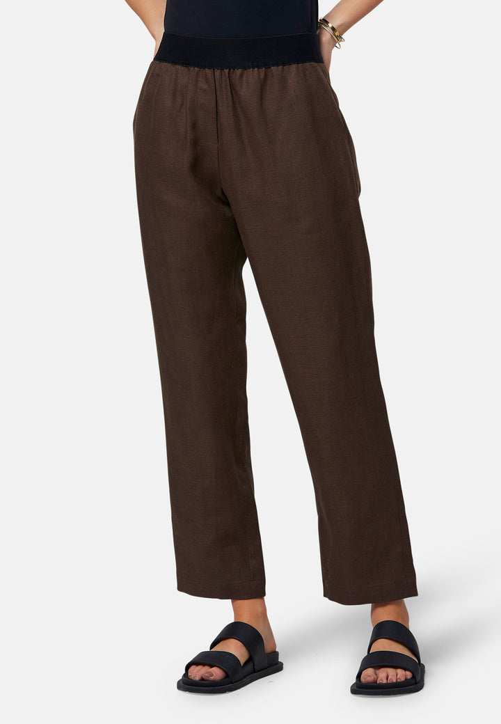 These relaxed-fit trousers in a rich brown hue are crafted from breathable Irish linen, making them perfect for casual, everyday wear. Featuring an elasticated waistband and practical back pocket, they offer both comfort and functionality. Pair them with sandals, the Cassie jacket and a simple top for a laid-back, effortless look.
