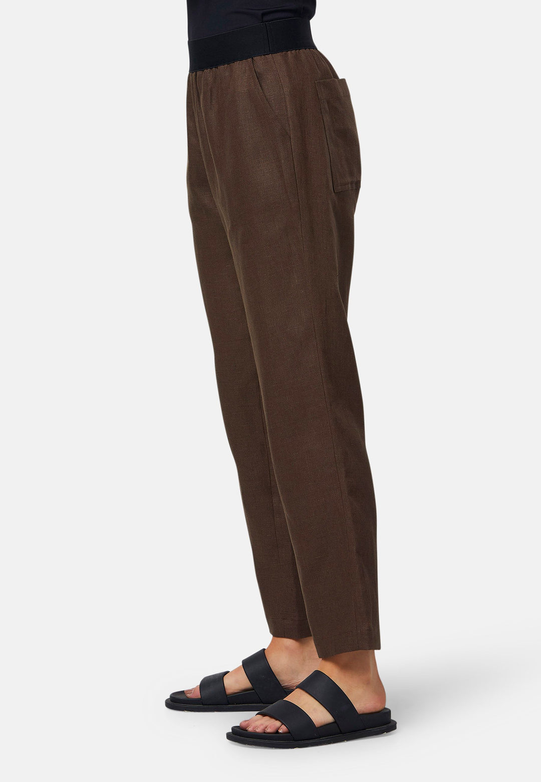 These relaxed-fit trousers in a rich brown hue are crafted from breathable Irish linen, making them perfect for casual, everyday wear. Featuring an elasticated waistband and practical back pocket, they offer both comfort and functionality. Pair them with sandals, the Cassie jacket and a simple top for a laid-back, effortless look.