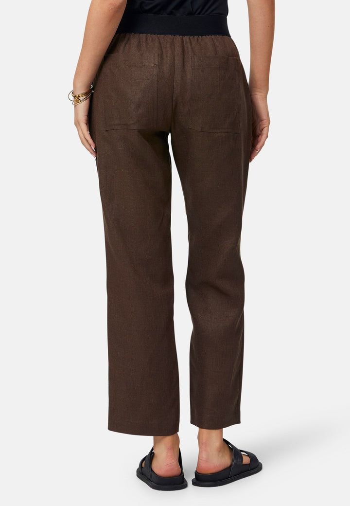 These relaxed-fit trousers in a rich brown hue are crafted from breathable Irish linen, making them perfect for casual, everyday wear. Featuring an elasticated waistband and practical back pocket, they offer both comfort and functionality. Pair them with sandals, the Cassie jacket and a simple top for a laid-back, effortless look.
