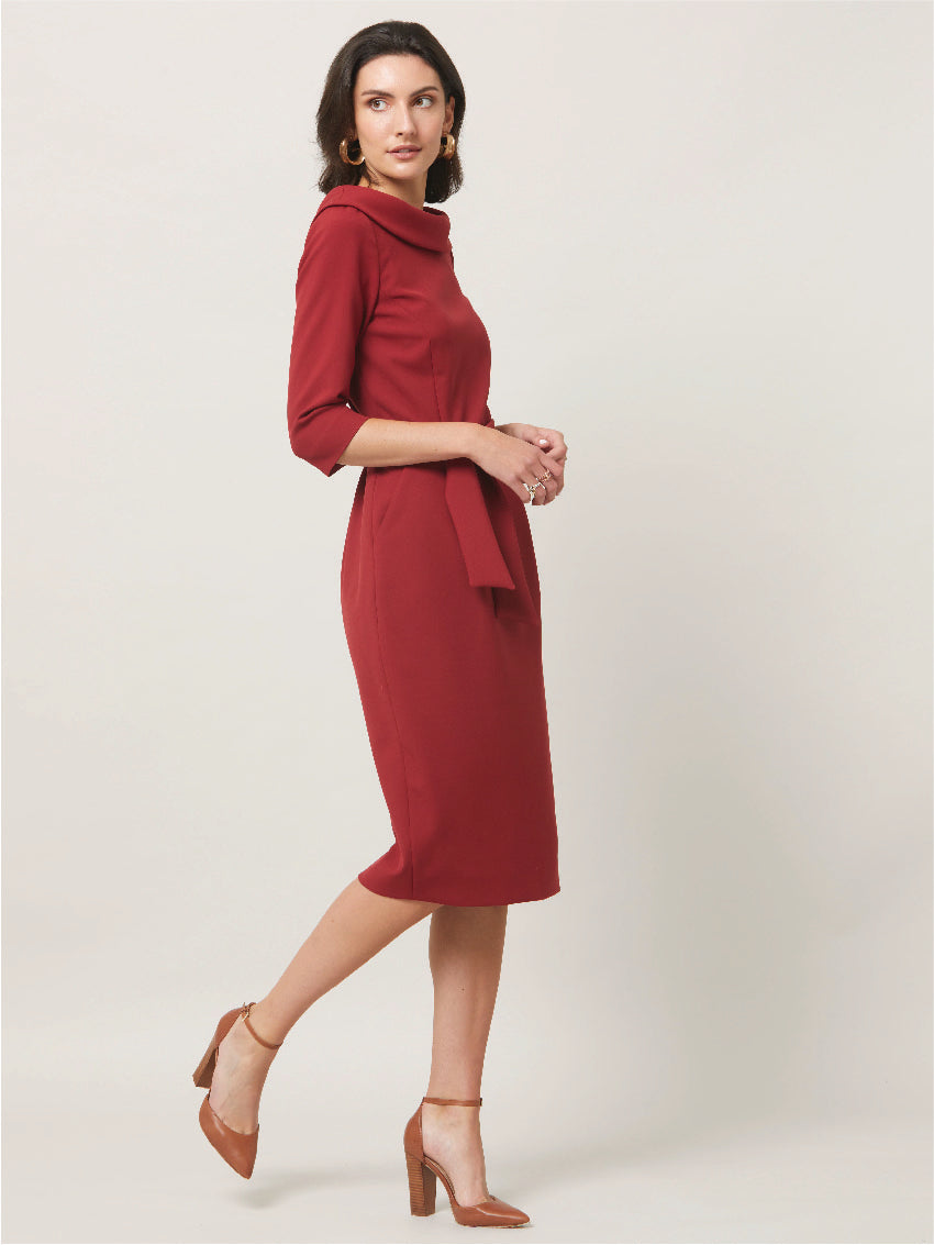 Dress for the occasion in the Mirren dress, inspired by hollywood glamour. Crafted in a sustainable, Russet tone, double crepe with a hint of stretch. features a velvet trimmed wide cowl neckline, body-skimming silhouette & a pencil skirt that falls below the knee. the detachable belt accentuates the waist. Sophisticated elegance for any occasion. Attending a winter wedding? Mother of the bride? Heading to the races? This is the dress for you.