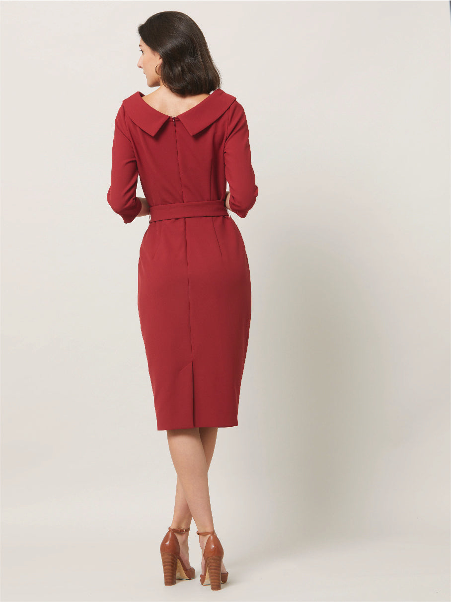 Dress for the occasion in the Mirren dress, inspired by hollywood glamour. Crafted in a sustainable, Russet tone, double crepe with a hint of stretch. features a velvet trimmed wide cowl neckline, body-skimming silhouette & a pencil skirt that falls below the knee. the detachable belt accentuates the waist. Sophisticated elegance for any occasion. Attending a winter wedding? Mother of the bride? Heading to the races? This is the dress for you.