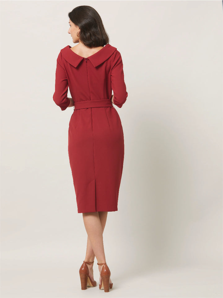 Dress for the occasion in the Mirren dress, inspired by hollywood glamour. Crafted in a sustainable, Russet tone, double crepe with a hint of stretch. features a velvet trimmed wide cowl neckline, body-skimming silhouette & a pencil skirt that falls below the knee. the detachable belt accentuates the waist. Sophisticated elegance for any occasion. Attending a winter wedding? Mother of the bride? Heading to the races? This is the dress for you.
