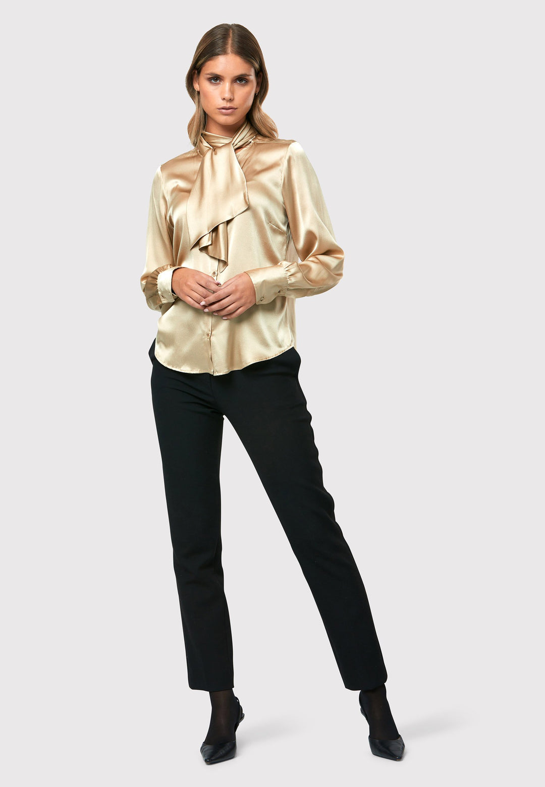  Crafted from a silk blend, it offers a luxurious feel against your skin. The button-down style pussy-bow neckline shirt.
