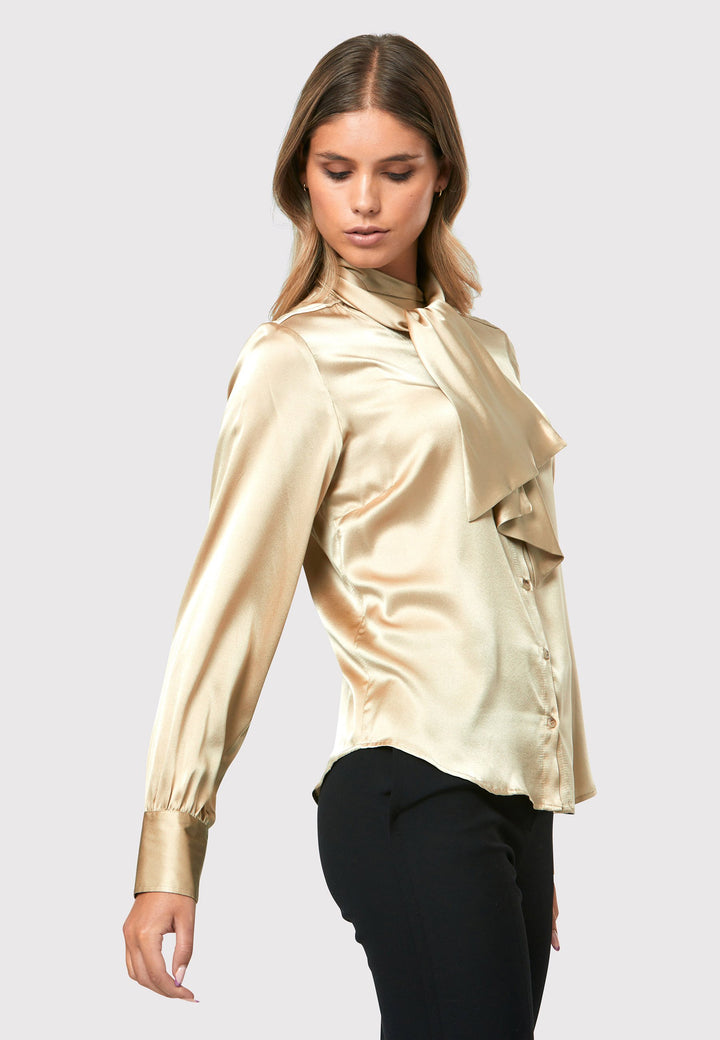  Crafted from a silk blend, it offers a luxurious feel against your skin. The button-down style pussy-bow neckline shirt.
