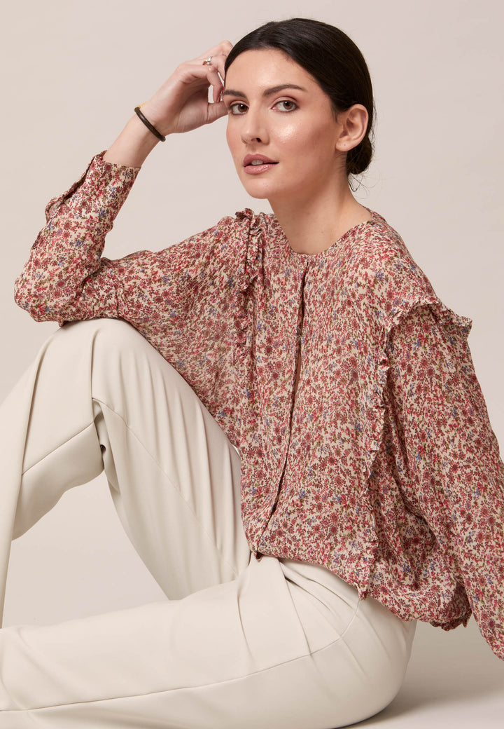 Give your everyday wardrobe an upgrade with the lauren jewel neck blouse. Cut in soft-touch silk blend crinkled georgette printed in feminine vintage inspired mini floral. A discreet ruffle runs from hem to hem over the shoulder. Lauren has been designed to add interest to the everyday.