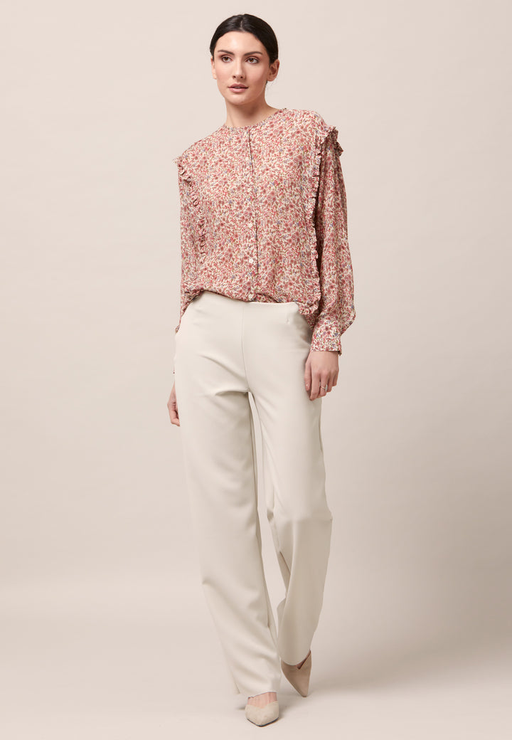 Give your everyday wardrobe an upgrade with the lauren jewel neck blouse. Cut in soft-touch silk blend crinkled georgette printed in feminine vintage inspired mini floral. A discreet ruffle runs from hem to hem over the shoulder. Lauren has been designed to add interest to the everyday.