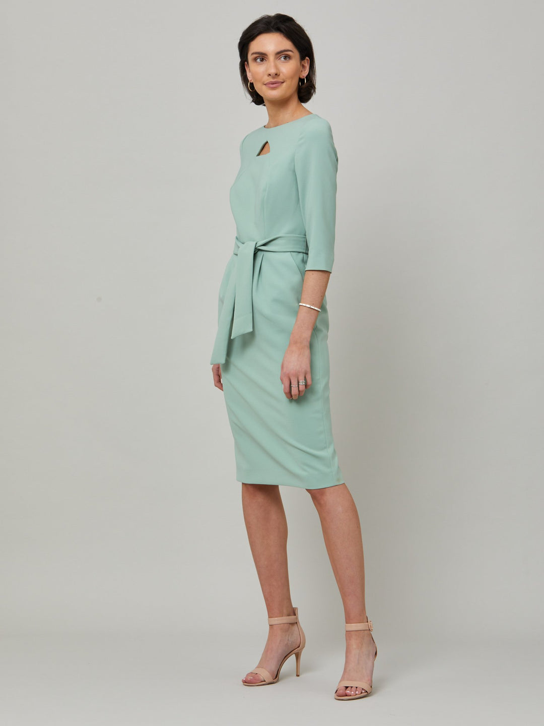 Beatrice is a fresh take on one of our key silhouettes. Features a statement diamond shape cut-out, belt and handy pockets. Crafted in our signature double crepe with a hint of stretch in willow green. Attending a summer wedding? Mother of the bride? Heading to the races? This is the dress for you.
