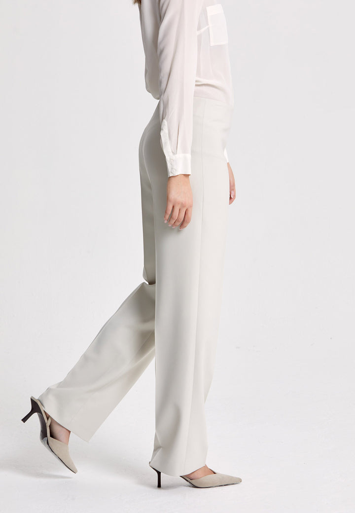 Investment-worthy, easy-fitting flat front pant. Relaxed straight leg crafted in a fluid tricotine. A wardrobe staple and HMcA classic. This fabric is made with a hint of elastane to ensure comfort and ease of movement. Shown here in a sophisticated neutral. Pair with a simple tee for workwear appeal or elevate your look with the coordinating blazer.