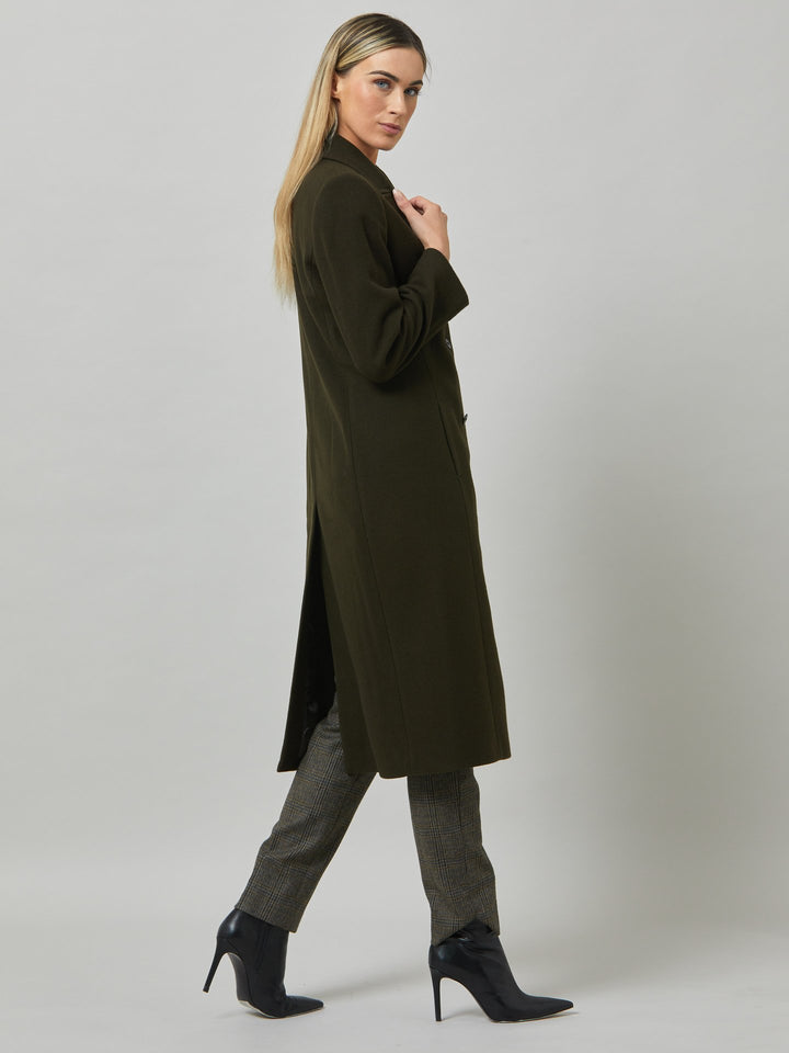 First impressions count, which is why great outerwear is a must. Invest in your wardrobe's hardest-working layer. Opt for the beryl coat. Note the double-breasted wrap front that creates a snug feel. The neat collar and revere is inspired by men's tailoring. It's cut from a wool blend in a dark olive melton. The style falls just below the knee.