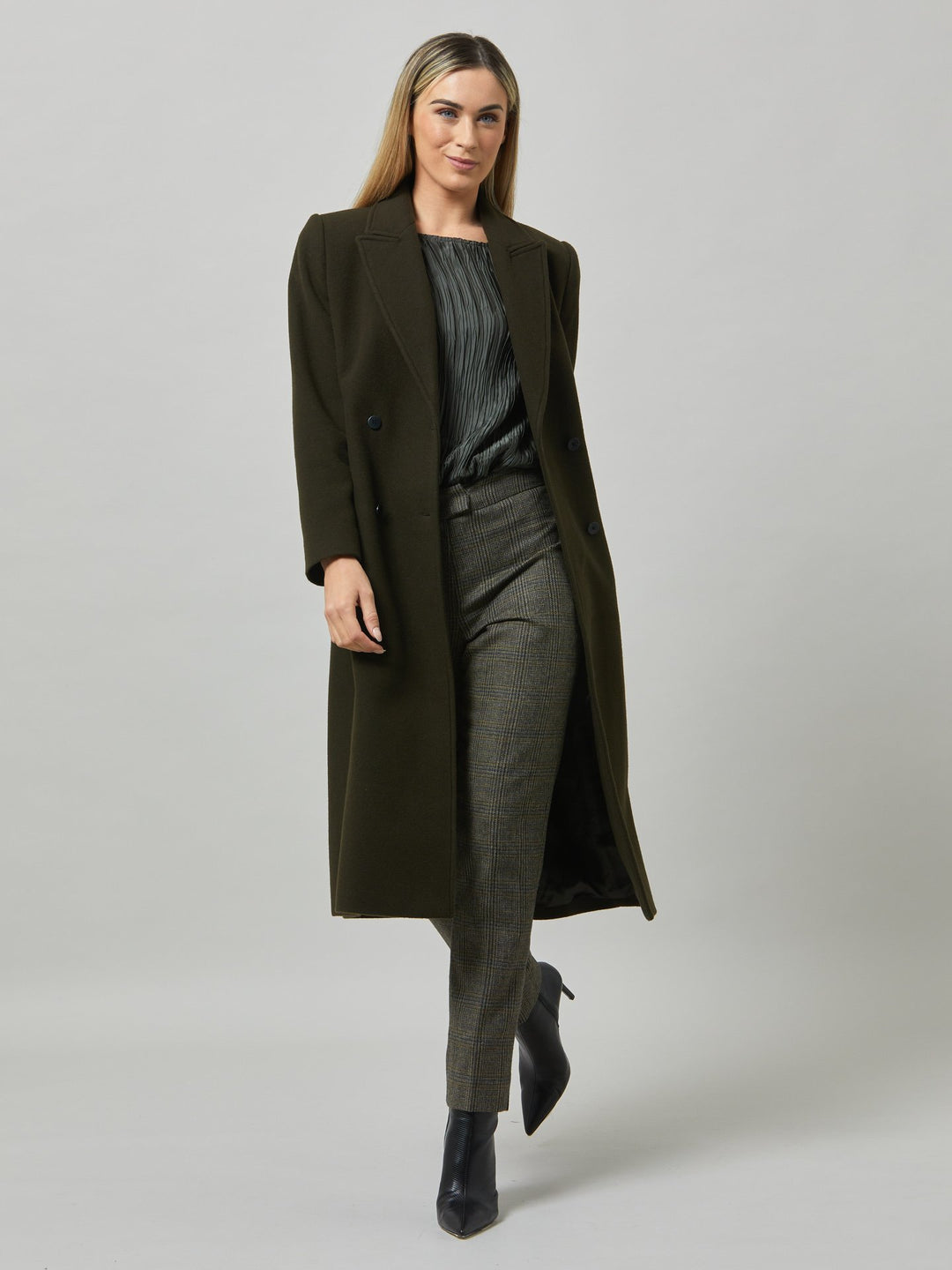 First impressions count, which is why great outerwear is a must. Invest in your wardrobe's hardest-working layer. Opt for the beryl coat. Note the double-breasted wrap front that creates a snug feel. The neat collar and revere is inspired by men's tailoring. It's cut from a wool blend in a dark olive melton. The style falls just below the knee.