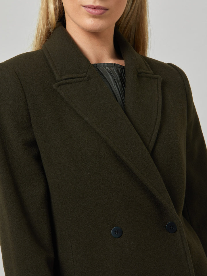 First impressions count, which is why great outerwear is a must. Invest in your wardrobe's hardest-working layer. Opt for the beryl coat. Note the double-breasted wrap front that creates a snug feel. The neat collar and revere is inspired by men's tailoring. It's cut from a wool blend in a dark olive melton. The style falls just below the knee.
