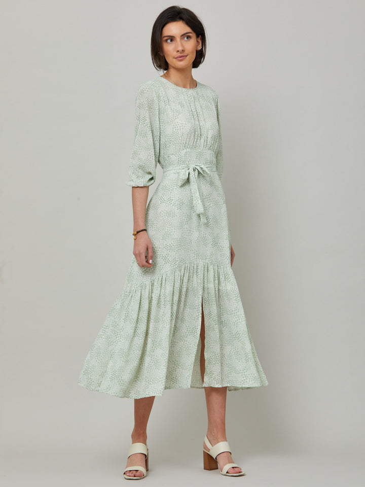 Meet the Bev dress in a vintage bi-color mini floral viscose crepe. Softly gathered jewel neck, waisted with side seam zip, draped 3/4 length sleeves fall to an elasticated cuff and flattering fluid bohemian tiered skirt with center front slit. Relaxed elegance for everyday life.