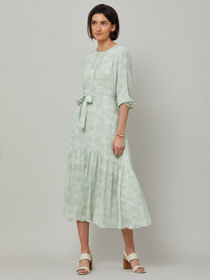 Meet the Bev dress in a vintage bi-color mini floral viscose crepe. Softly gathered jewel neck, waisted with side seam zip, draped 3/4 length sleeves fall to an elasticated cuff and flattering fluid bohemian tiered skirt with center front slit. Relaxed elegance for everyday life.