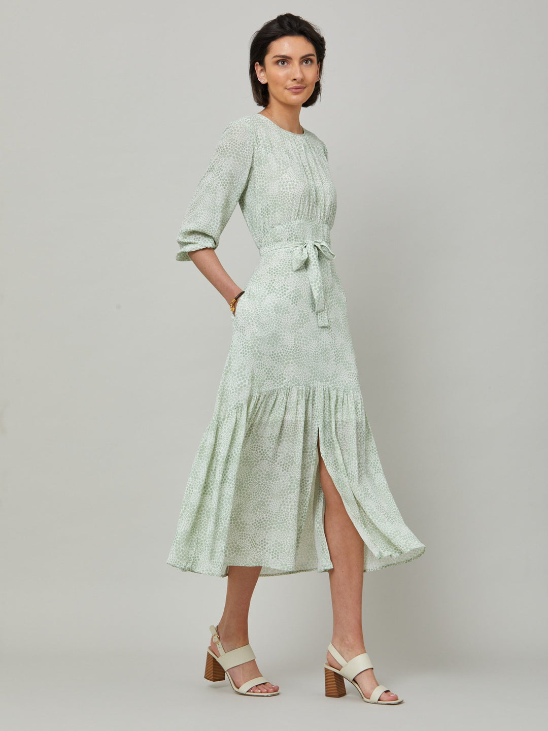 Meet the Bev dress in a vintage bi-color mini floral viscose crepe. Softly gathered jewel neck, waisted with side seam zip, draped 3/4 length sleeves fall to an elasticated cuff and flattering fluid bohemian tiered skirt with center front slit. Relaxed elegance for everyday life.