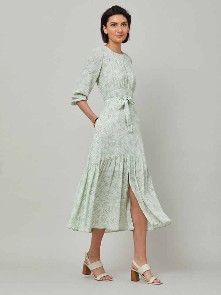 Meet the Bev dress in a vintage bi-color mini floral viscose crepe. Softly gathered jewel neck, waisted with side seam zip, draped 3/4 length sleeves fall to an elasticated cuff and flattering fluid bohemian tiered skirt with center front slit. Relaxed elegance for everyday life.