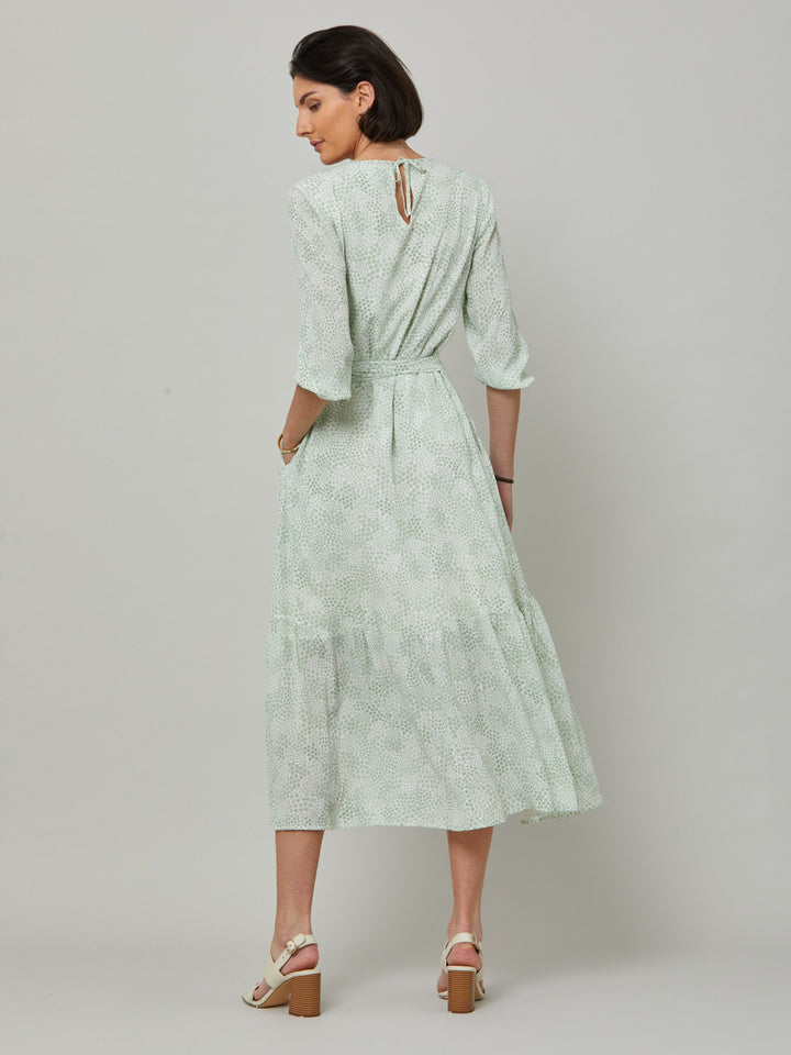 Meet the Bev dress in a vintage bi-color mini floral viscose crepe. Softly gathered jewel neck, waisted with side seam zip, draped 3/4 length sleeves fall to an elasticated cuff and flattering fluid bohemian tiered skirt with center front slit. Relaxed elegance for everyday life.
