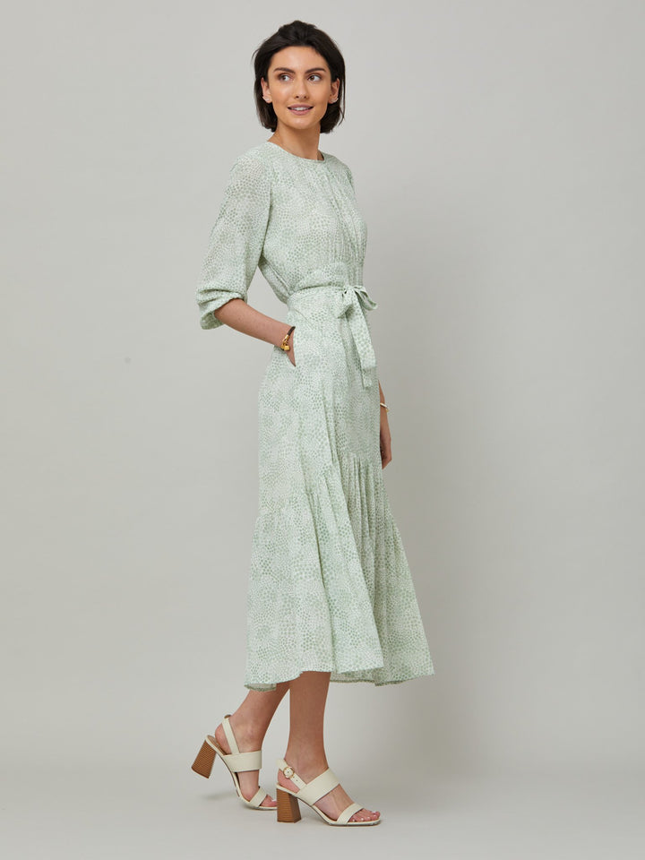 Meet the Bev dress in a vintage bi-color mini floral viscose crepe. Softly gathered jewel neck, waisted with side seam zip, draped 3/4 length sleeves fall to an elasticated cuff and flattering fluid bohemian tiered skirt with center front slit. Relaxed elegance for everyday life.