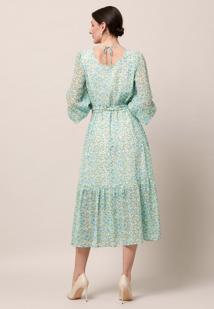 Opt for the Bev dress in a nuanced print to bring elegance to your everyday edit this season and beyond. Crafted in a sweeping midi-silhouette. The design is rooted in simplicity with a fit and softly flare skirt. Engineered Jewel neckline in this dress is accentuated with soft gathers. Waist is accentuated with a soft belt around the midriff for a customisable look that cinches the profile. The belt can be tied in the front or the back for added versatility. 