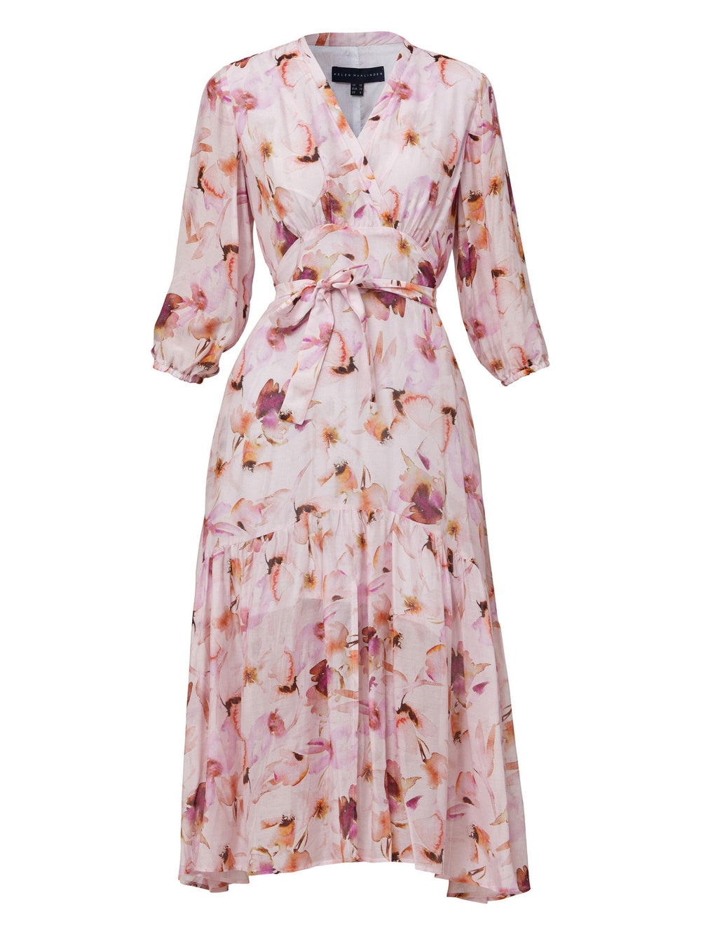 Beverly, the ultimate summer day dress. This statement piece features a cross over V-neck detail, a flattering back waist tie, voluminous sleeves and front slit. Crafted in our super soft silk in a delicate watercolour floral print. Perfect for summer weddings, garden parties or wherever you'd like to make an entrance.