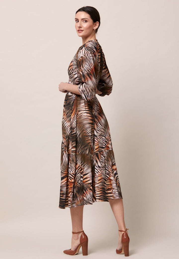 Opt for the Beverly in a nuanced print to bring elegance to your everyday edit this season and beyond. Crafted in a sweeping midi-silhouette. The design is rooted in simplicity with a fit and flare skirt. Engineered with an elegant cross over V-neckline. Waist is accentuated with a soft belt around the midriff for a customisable look that cinches the profile. The belt can be tied in the front or the back for added versatility. 