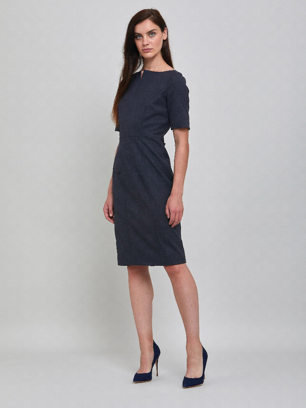 In a body-skimmy silhouette, this knee-length dress wears well with stilettos working as a desk-to-dinner perfect option. The neckline adds an extra something to this simple yet elegant staple