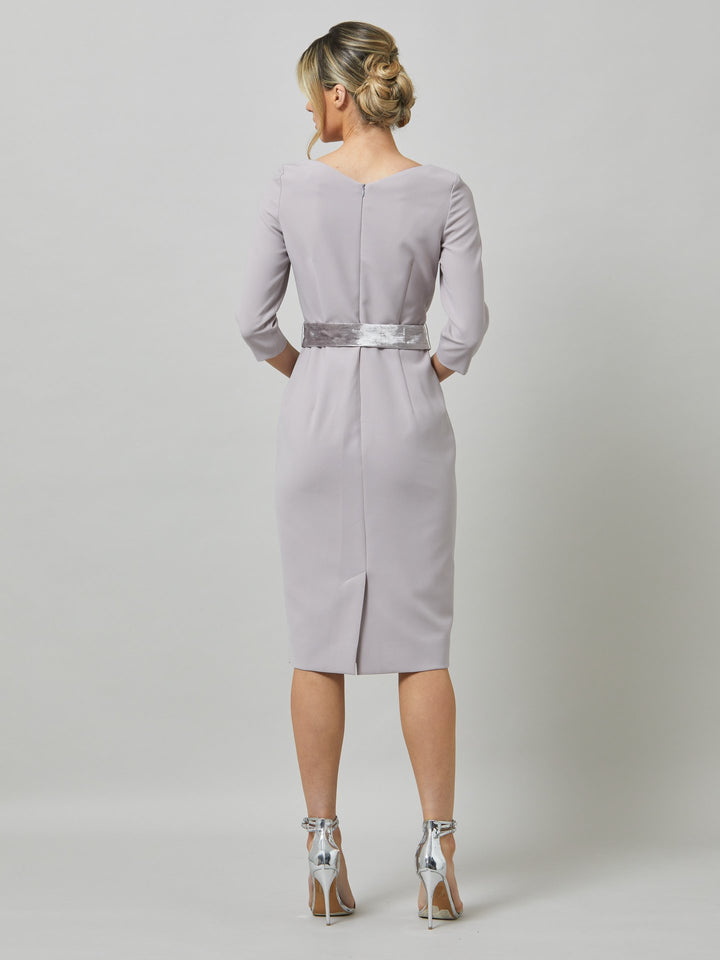Caroline, the perfect desk-to-dinner dress in a feminine champagne tone. The fabric falls softly over the hips. this slash neck dress falls below the knee & pockets lend a sense of ease. Crafted luxe tricotine with a hint of stretch which ensures comfort & fit. Style with or without the matching velvet belt.