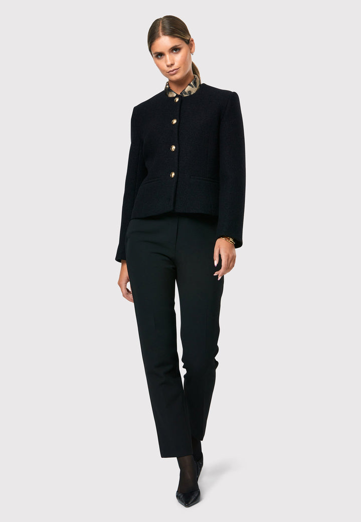 Introducing the Cassandra Black Jacket, a sleek and fitted piece crafted from a textured black boucle fabric. With its softly tailored silhouette, this jacket exudes modern elegance. The gold detail buttons add a touch of sophistication and elevate the overall aesthetic. Pair it effortlessly with the classic Jill pant for a timeless ensemble. The contemporary silhouette of the Cassandra Black Jacket is destined to become your go-to workwear icon for the season.