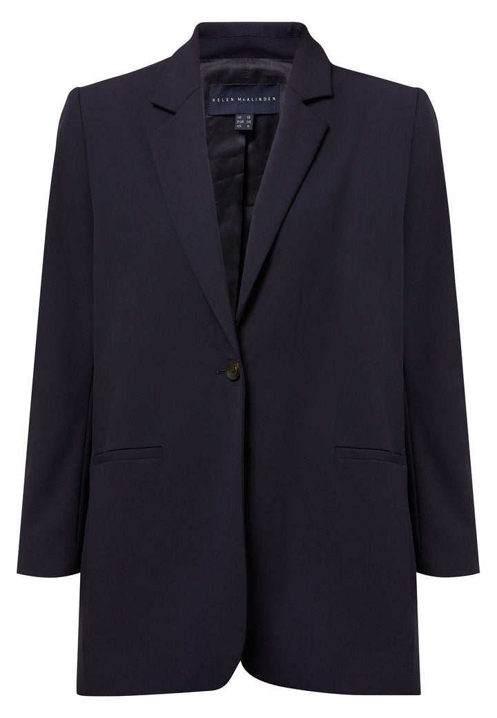 Cassie, the investment-worthy Dark Navy Boyfriend blazer. Perfectly tailored in a lightweight wool. Minimalist styling with a single button fastening. An oversized and slightly boxy silhouette. Perfect transeasonal outerwear. Team it with the co-ordinating Jill pant and the ella utility shirt for a contemporary look.