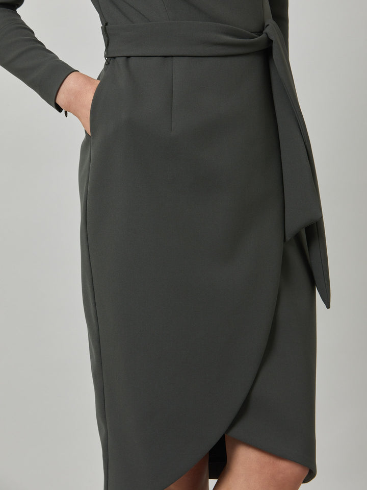 Celina, an elegant faux wrap pencil skirt dress in a smokey olive tone. Workwear redefined, the perfect desk to dinner dress. this body skimming silhouette falls below the knee and belted at the waist for a cinched profile, the ideal combination to accentuate the profile. Simply pair with heels for effortless elegance.