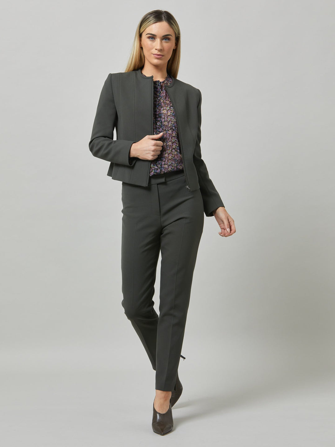 Upgrade your workwear options with the christiana smoky olive jacket. cut in our signature double crepe with a hint of stretch. Offers comfort & functionality. Engineered with an elegant seamed silhouette & center front zip. Pair with the co-ordinating jill trouser. This contemporary silhouette will become your workwear icon for the season.
