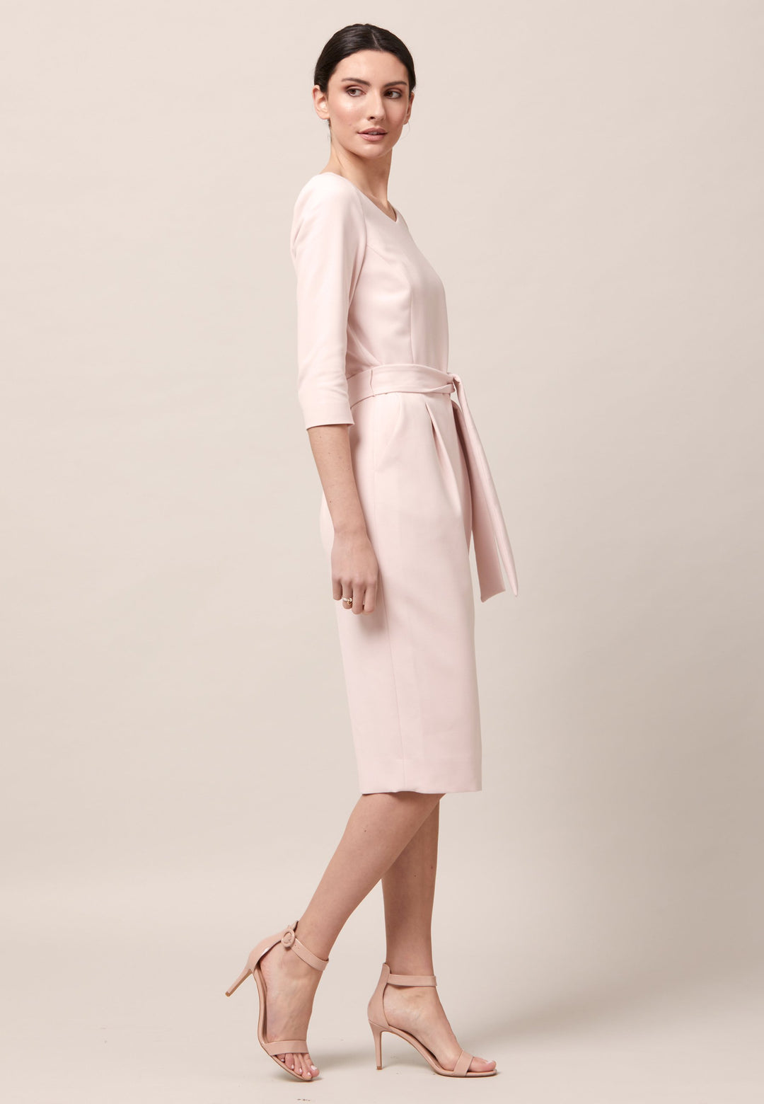 The Clara is a classic silhouette. An expertly tailored form-flattering silhouette with pockets, detachable belt & pencil skirt which falls to mid-calf. Engineered with a sophisticated wide V-neckline. Crafted from sustainably sourced fibers with a hint of stretch to ensure comfort & ease of movement. Heighten the drama of this piece with your favourite accessories and heels. Attending a summer wedding? Mother of the bride? Heading to the races? This is the dress for you.