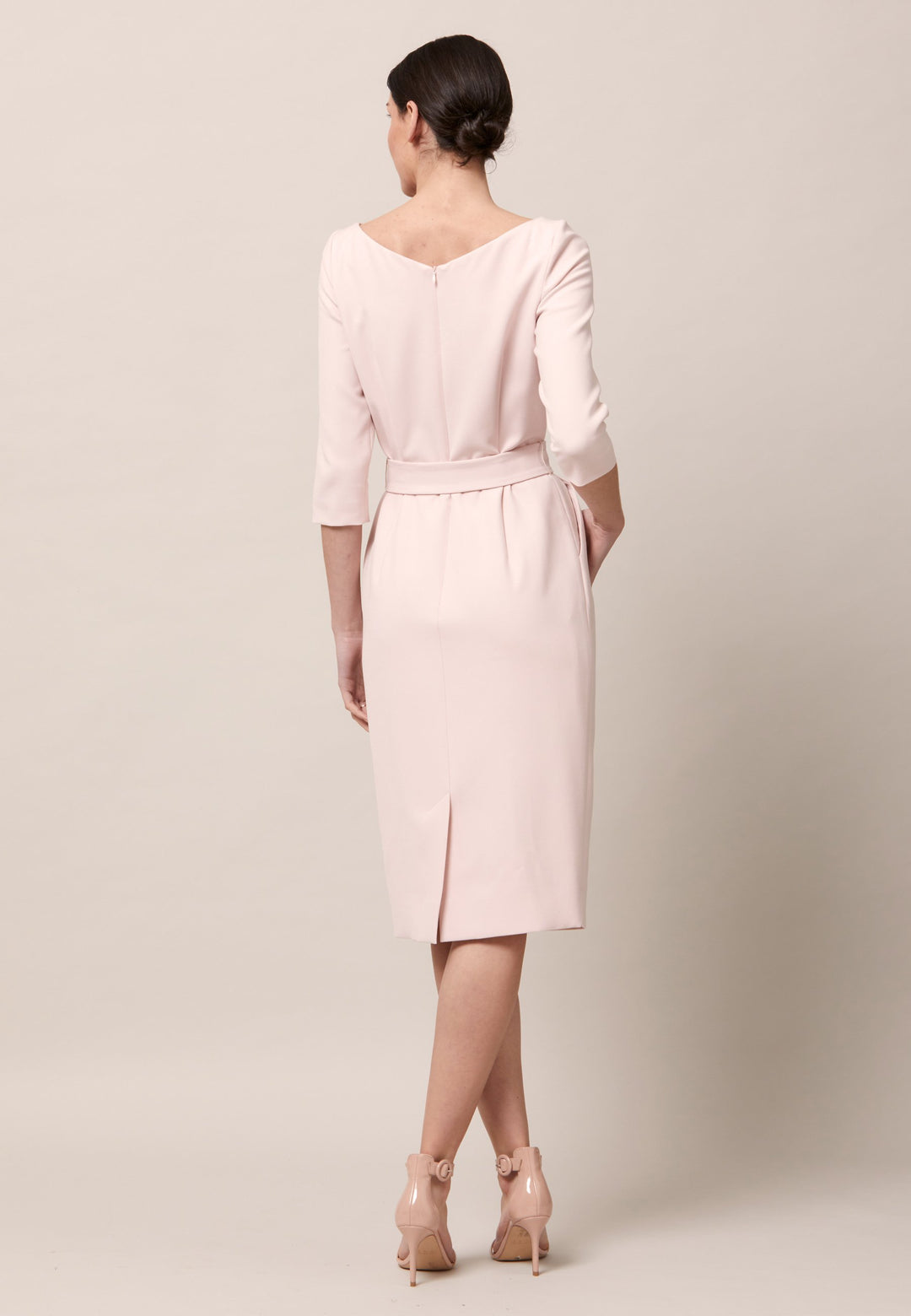 The Clara is a classic silhouette. An expertly tailored form-flattering silhouette with pockets, detachable belt & pencil skirt which falls to mid-calf. Engineered with a sophisticated wide V-neckline. Crafted from sustainably sourced fibers with a hint of stretch to ensure comfort & ease of movement. Heighten the drama of this piece with your favourite accessories and heels. Attending a summer wedding? Mother of the bride? Heading to the races? This is the dress for you.