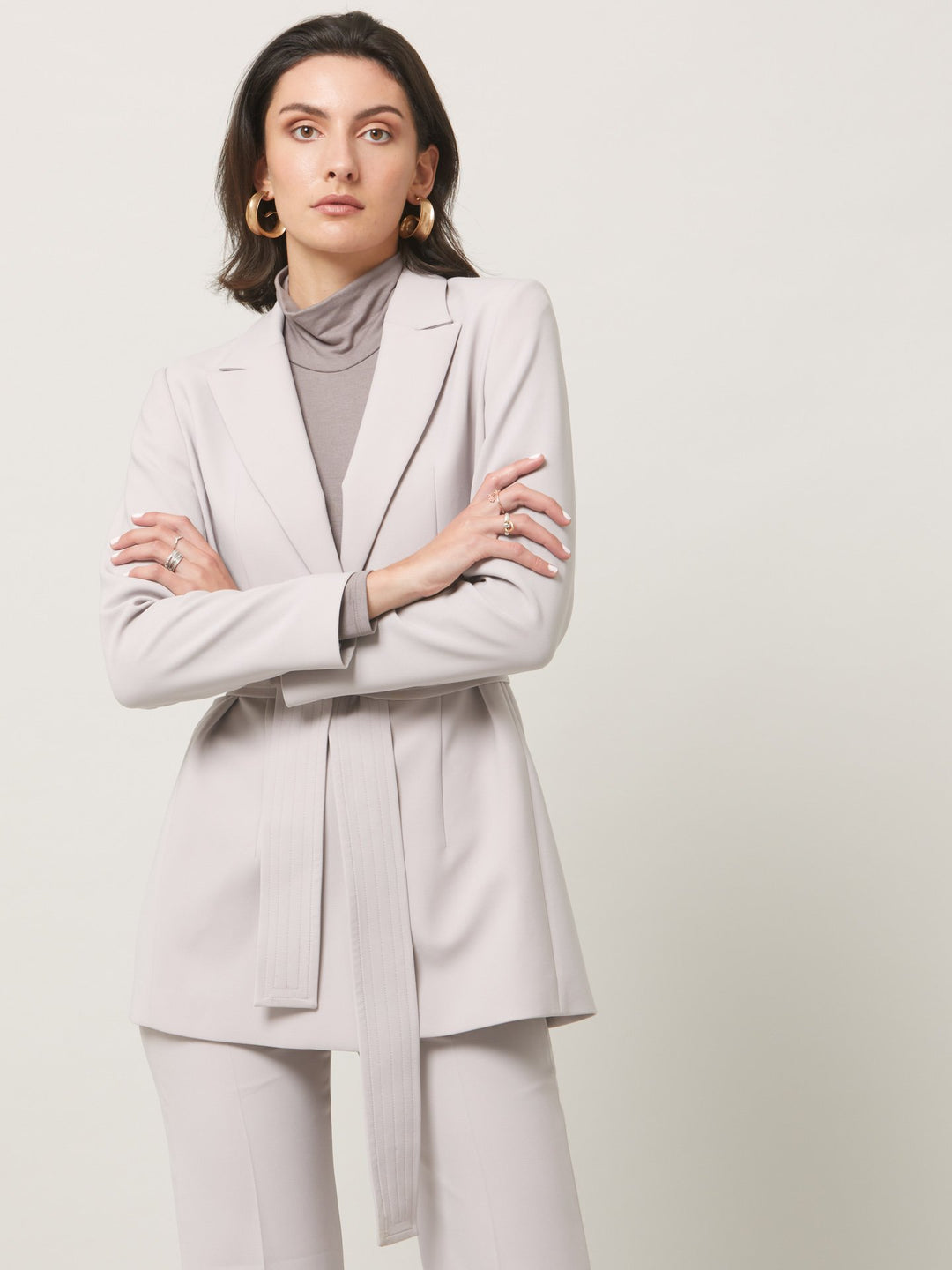 A signature hmca piece. our perennial best-seller. This versatile top features a flattering mesh yoke and sleeves on a snug jersey body. Perfect underpinning to suiting or a more casual pant.