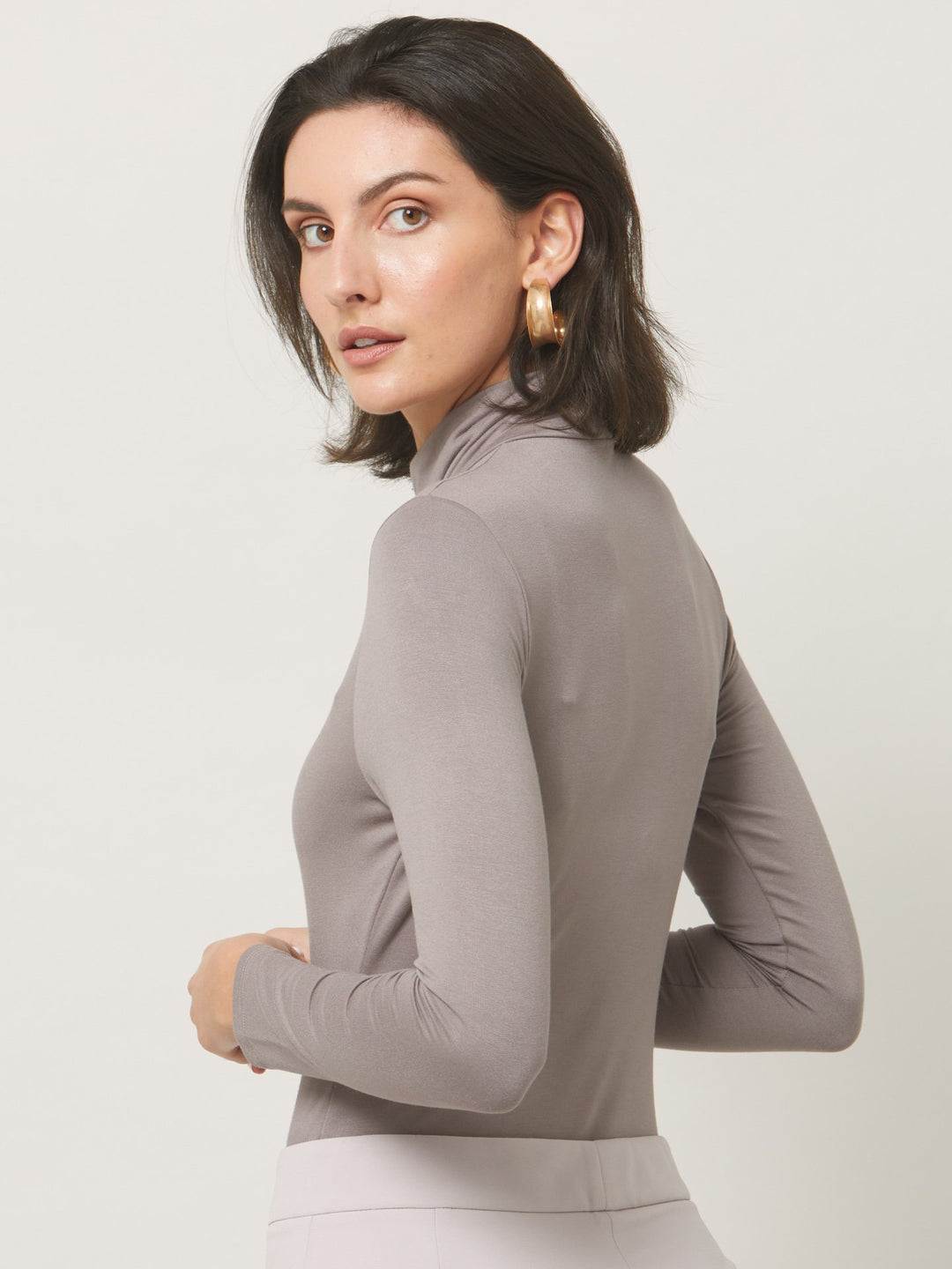 A signature hmca piece. our perennial best-seller. This versatile top features a flattering mesh yoke and sleeves on a snug jersey body. Perfect underpinning to suiting or a more casual pant.
