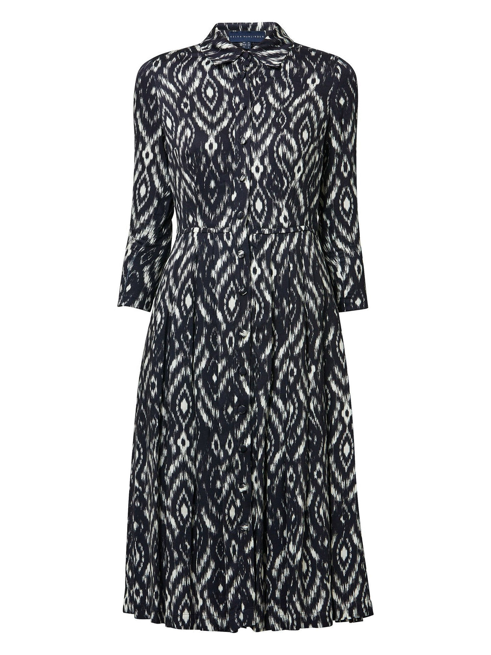 Sonia, a feminine take on the shirt dress. crafted in a fluid black and cream ikat printed viscose. A softly pleated skirt that falls to mid-calf. Wear to work, to the theatre, or out for cocktails with the girls. A simple yet feminine silhouette.