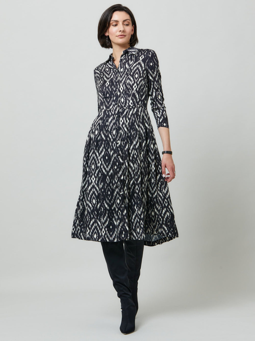 Sonia, a feminine take on the shirt dress. crafted in a fluid black and cream ikat printed viscose. A softly pleated skirt that falls to mid-calf. Wear to work, to the theatre, or out for cocktails with the girls. A simple yet feminine silhouette.