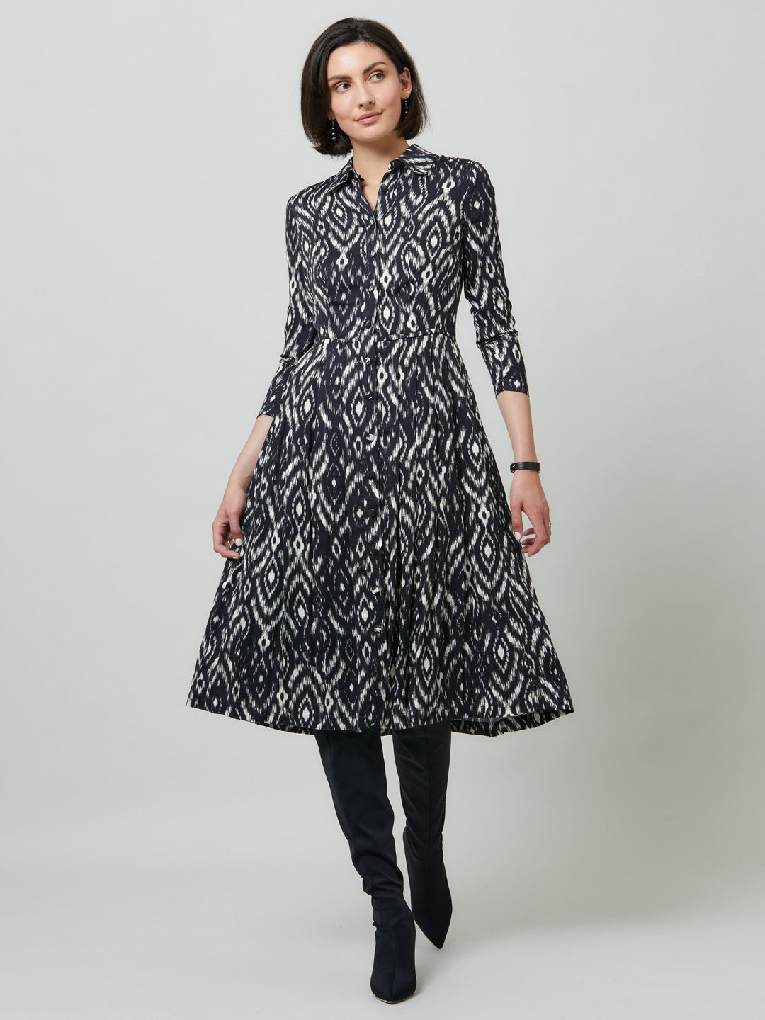 Sonia, a feminine take on the shirt dress. crafted in a fluid black and cream ikat printed viscose. A softly pleated skirt that falls to mid-calf. Wear to work, to the theatre, or out for cocktails with the girls. A simple yet feminine silhouette.