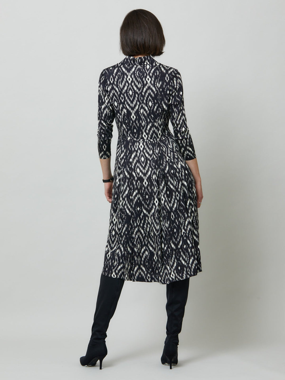 Sonia, a feminine take on the shirt dress. crafted in a fluid black and cream ikat printed viscose. A softly pleated skirt that falls to mid-calf. Wear to work, to the theatre, or out for cocktails with the girls. A simple yet feminine silhouette.