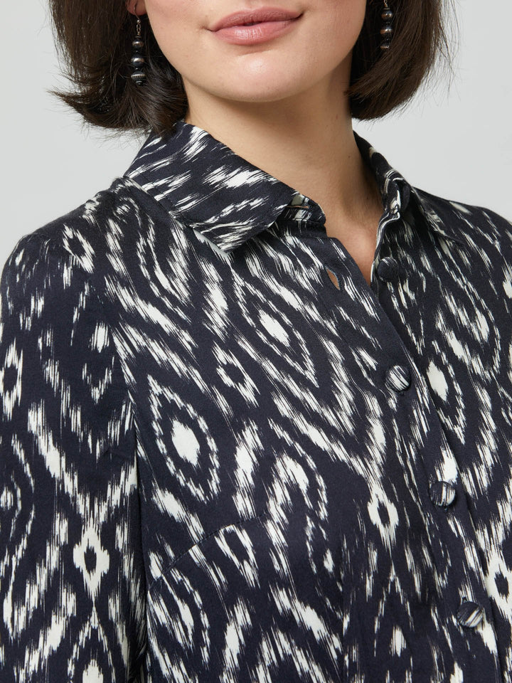 Sonia, a feminine take on the shirt dress. crafted in a fluid black and cream ikat printed viscose. A softly pleated skirt that falls to mid-calf. Wear to work, to the theatre, or out for cocktails with the girls. A simple yet feminine silhouette.